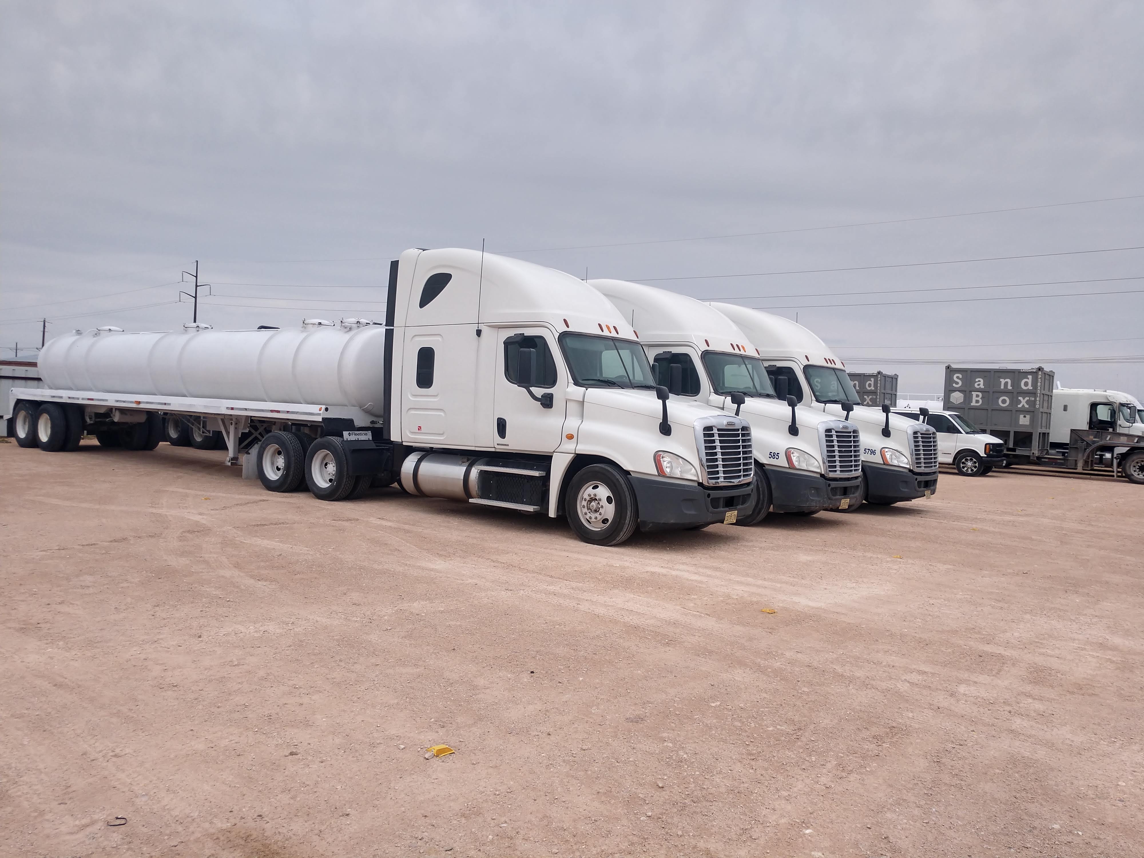 Fleet of semi trucks parked securely at CADD