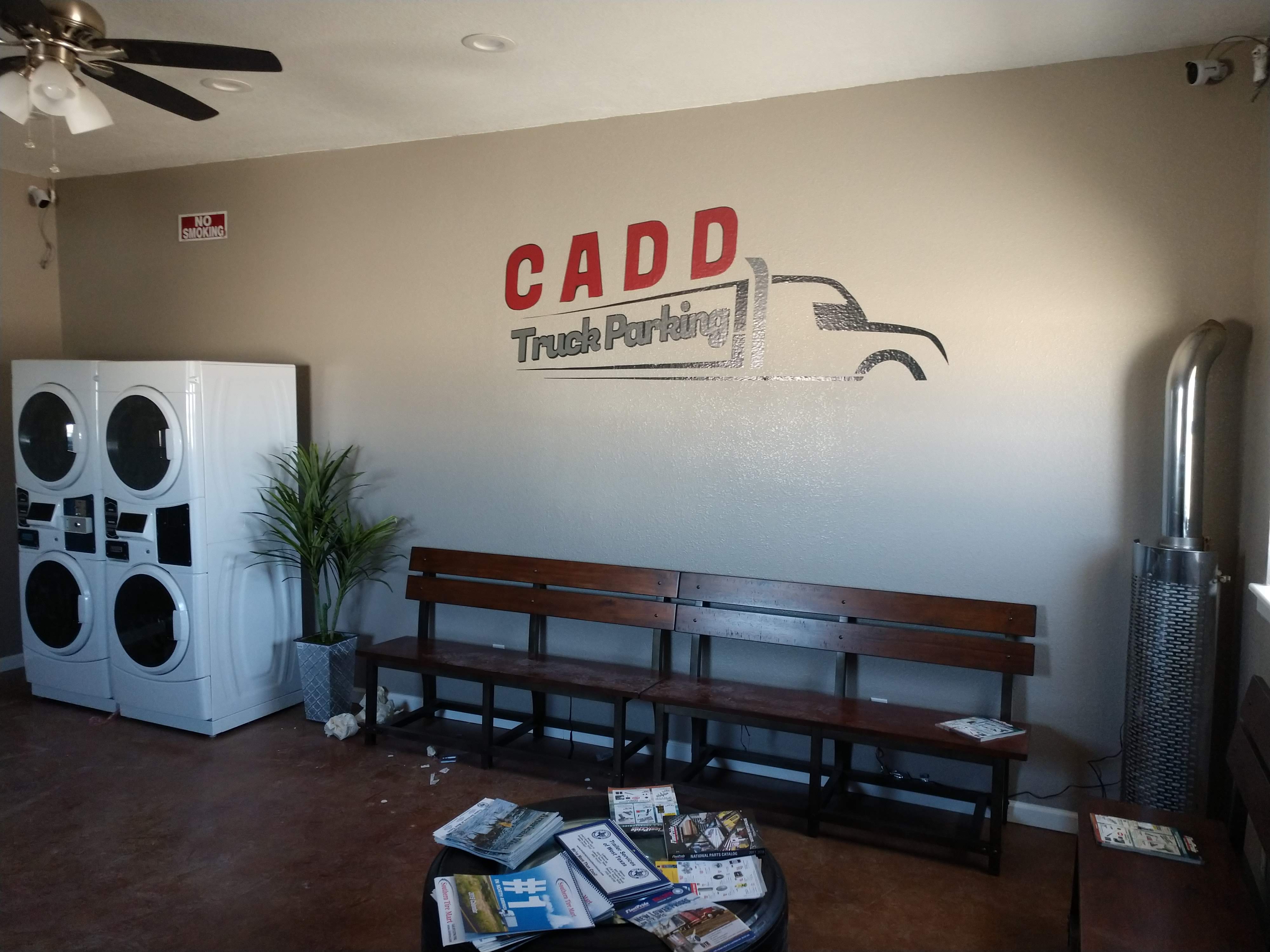 CADD driver lounge with logo, laundry, and tire table